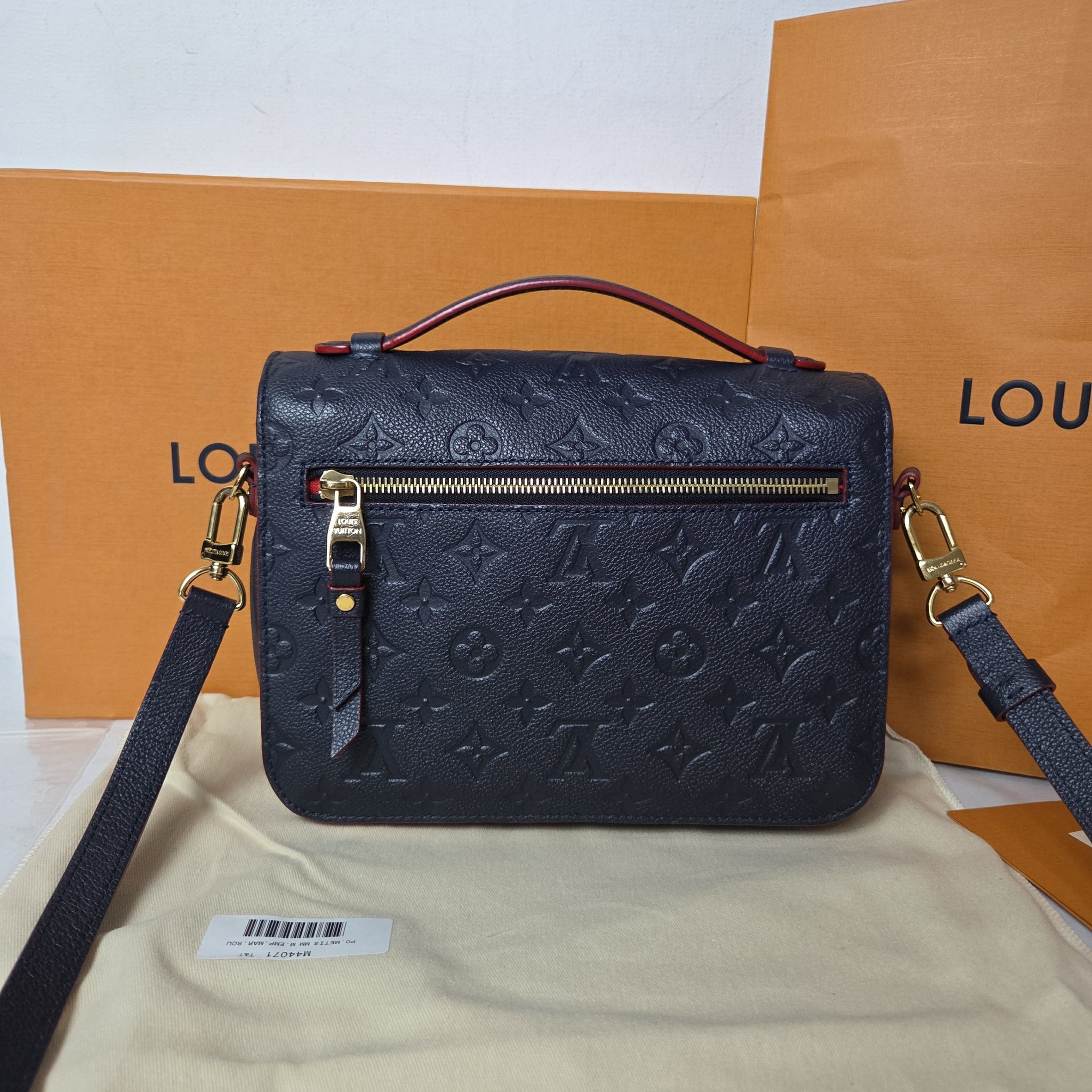 Louis Vuitton Pochette Métis bag in Marine Rouge Monogram Empreinte leather